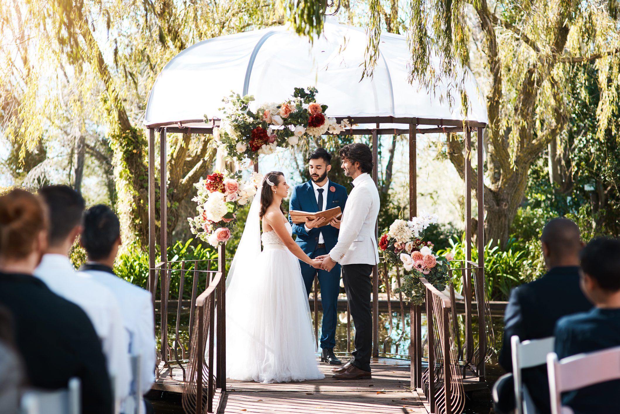 Couple exchanging vows in garden setting