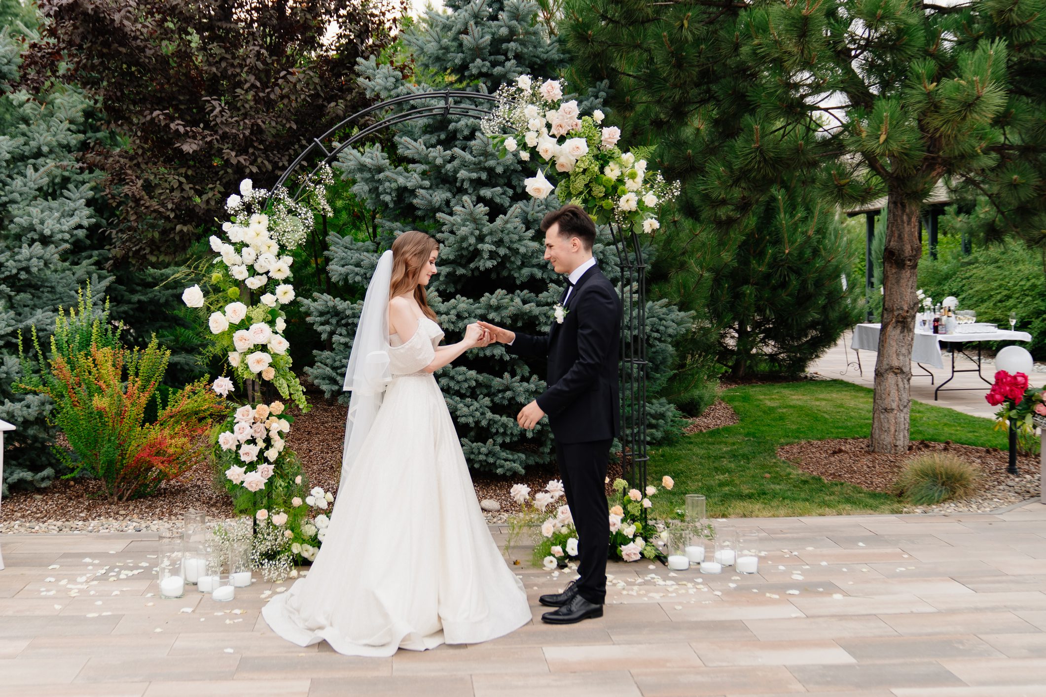 Bride and groom exchanging vows outdoors